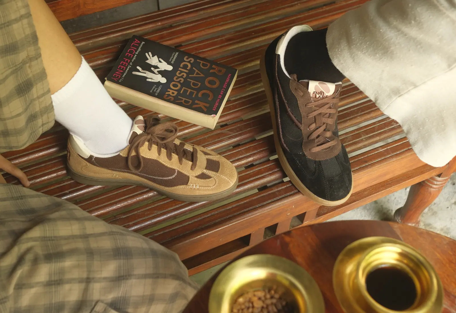 Both Kaapi colourways worn around a café table